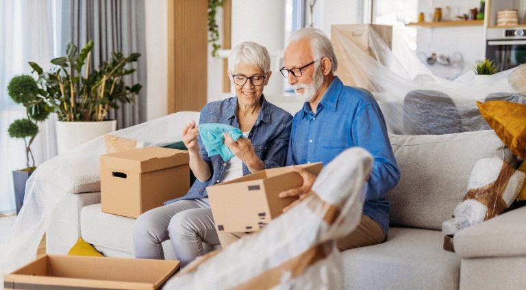 couple on unpacking on couch