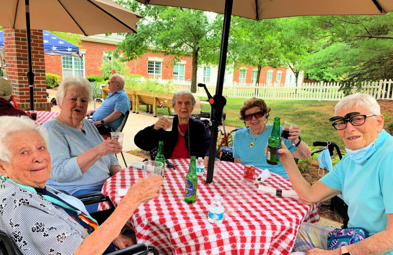 Beverly Strauss with friends at picnic table