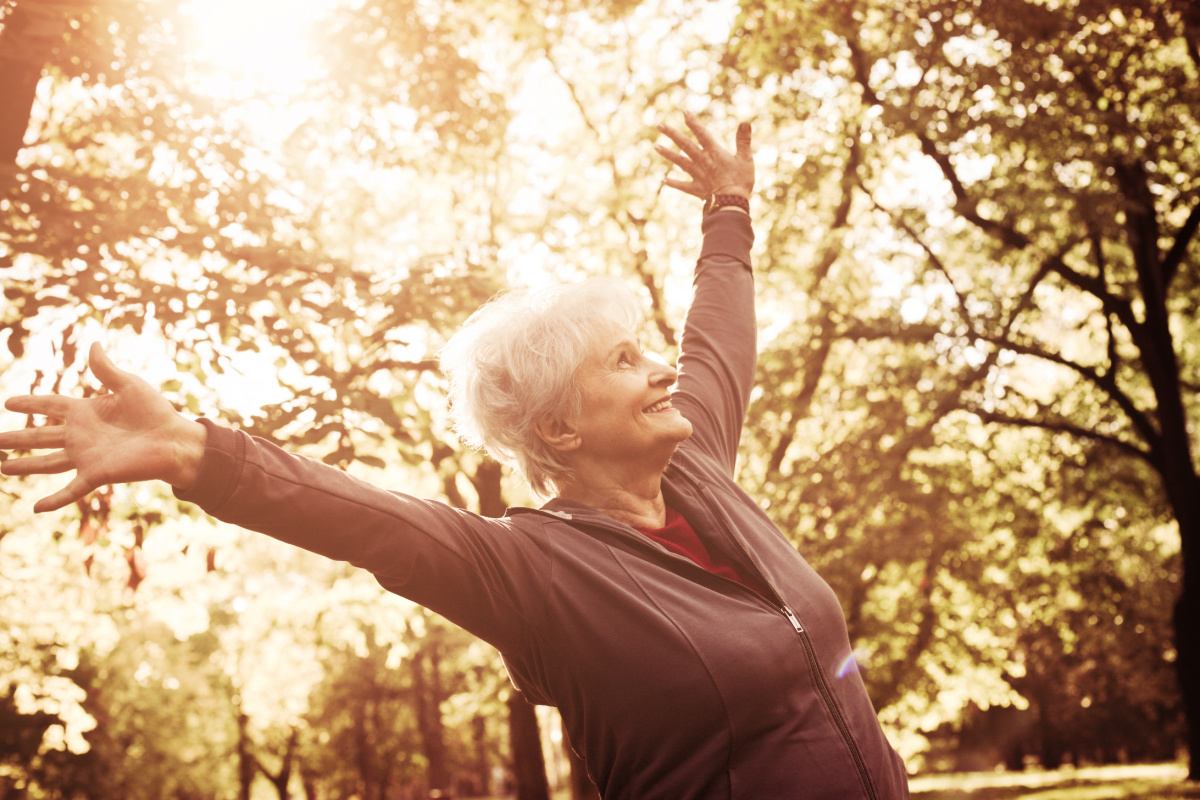 woman stretching in forest