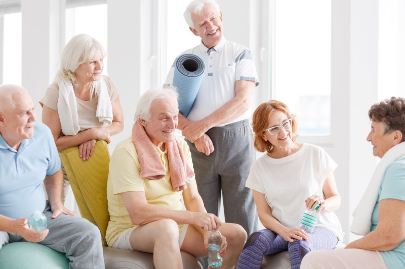 group of people getting ready for yoga