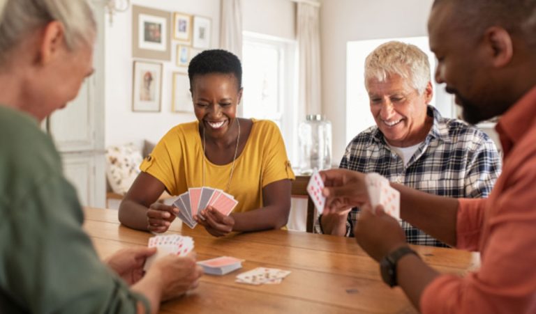 four people playing cards