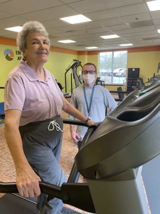 mike and woman walking on treadmill