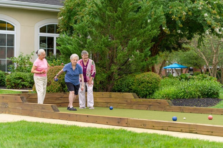 three women lawn bowling