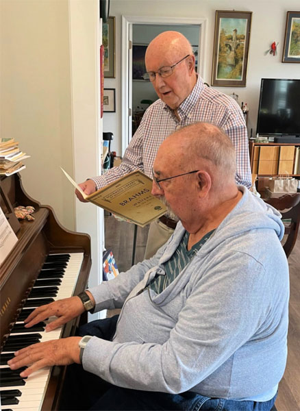 man singing & and man playing piano