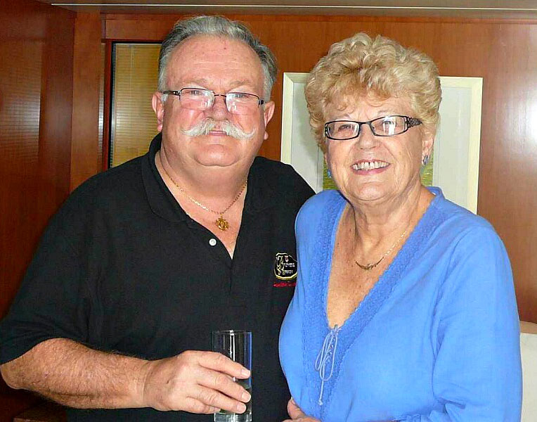 couple smiling with glass