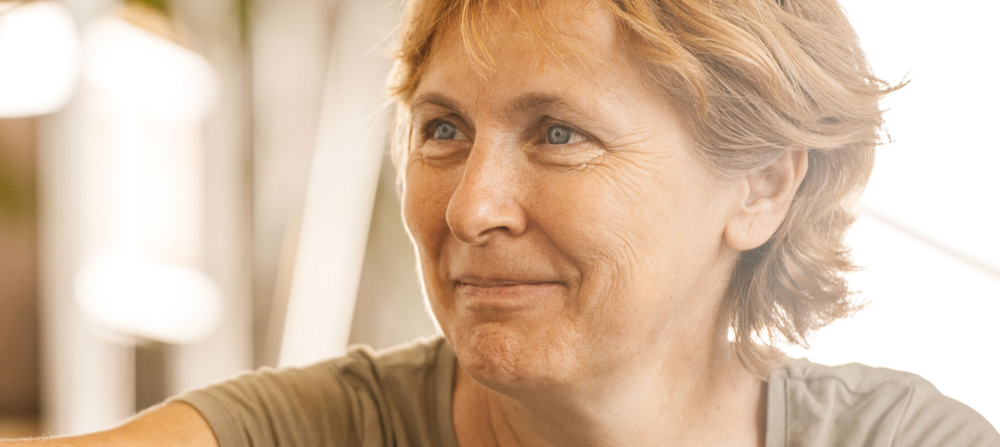 Close up of a face of a smiling senior woman.