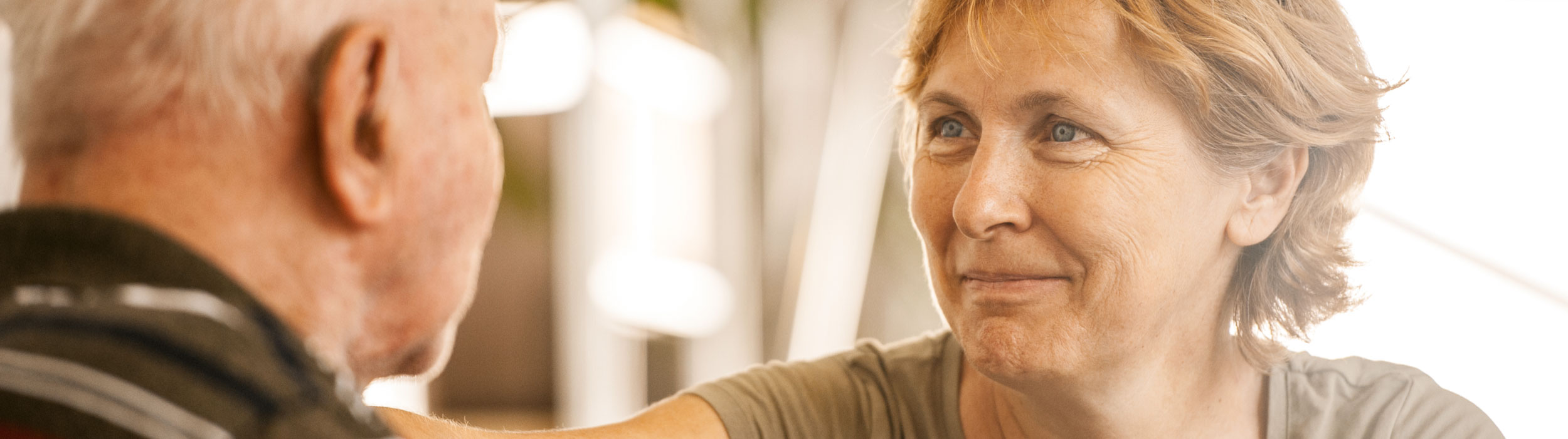 Close up of a face of a smiling senior woman.