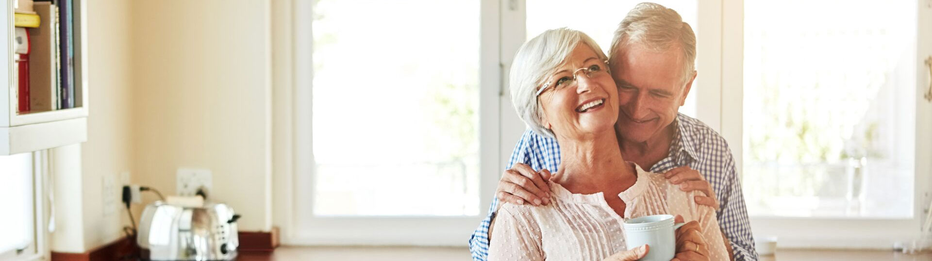 a smiling elderly couple