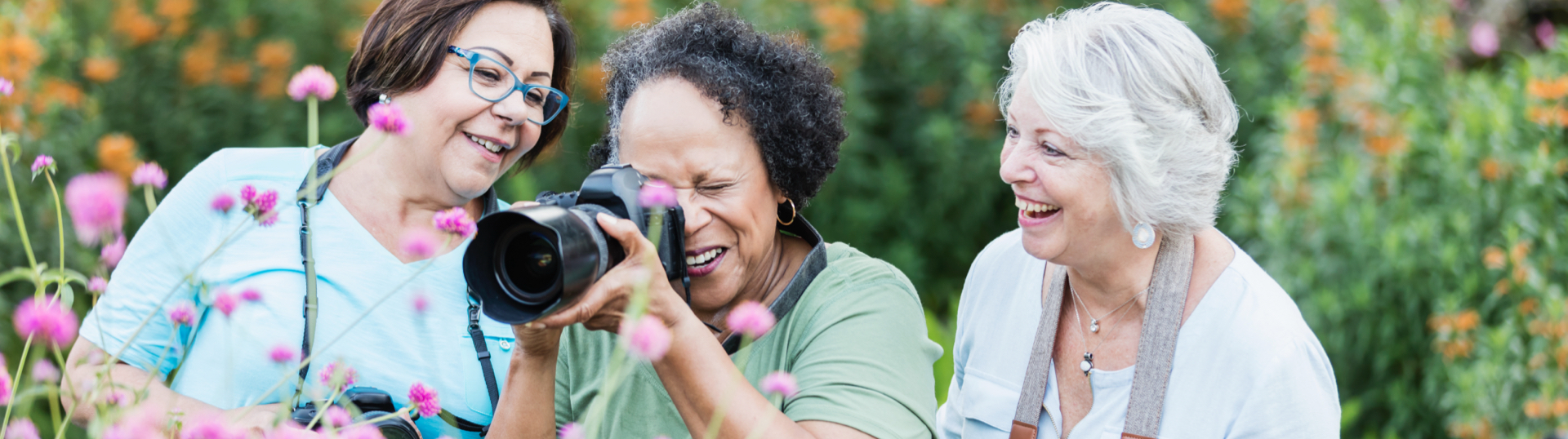 3 women with camera