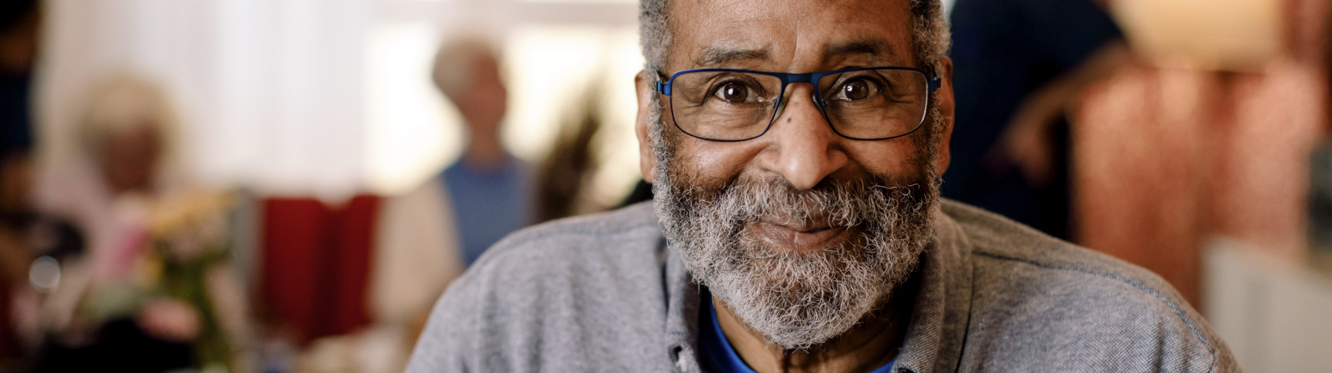 man with glasses smiling