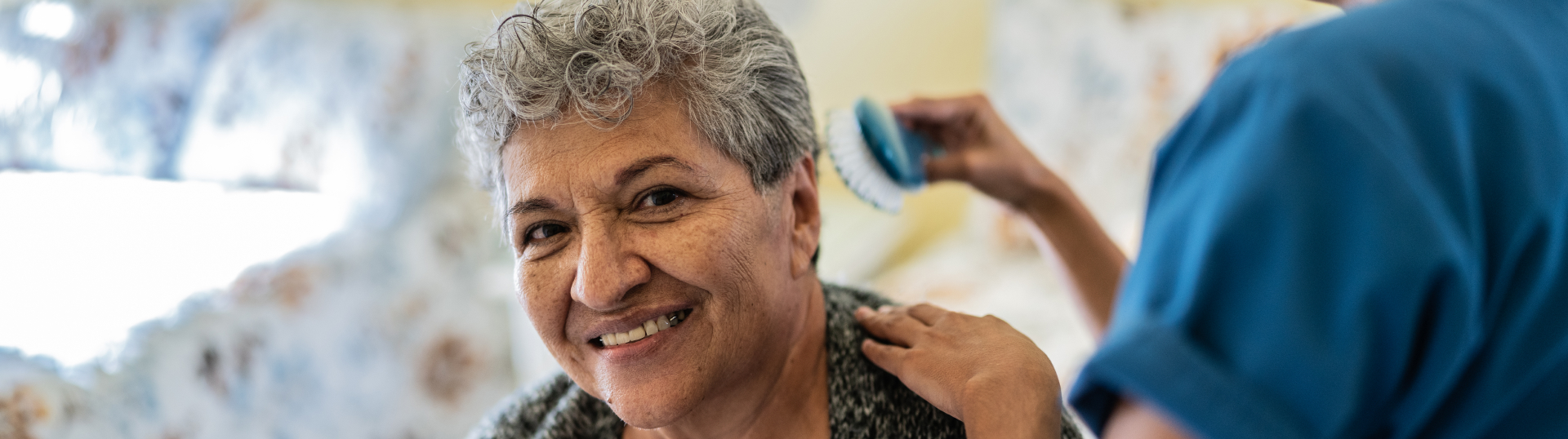 Woman getting hair brushed