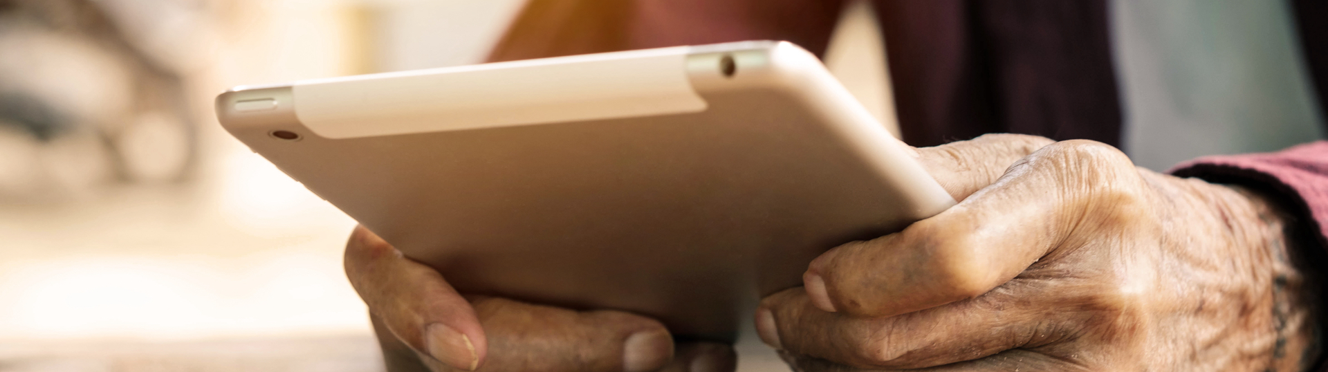 hands holding a tablet