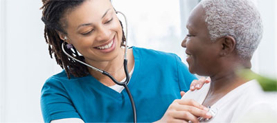 nurse taking patient heartbeat