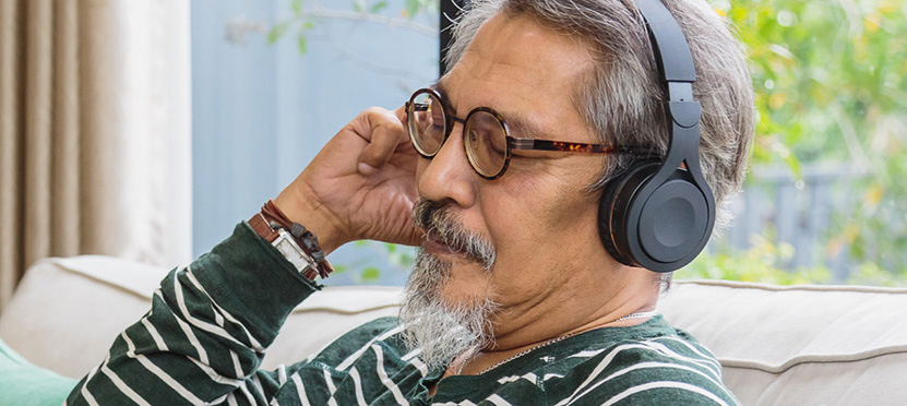 man with glasses & headphones on