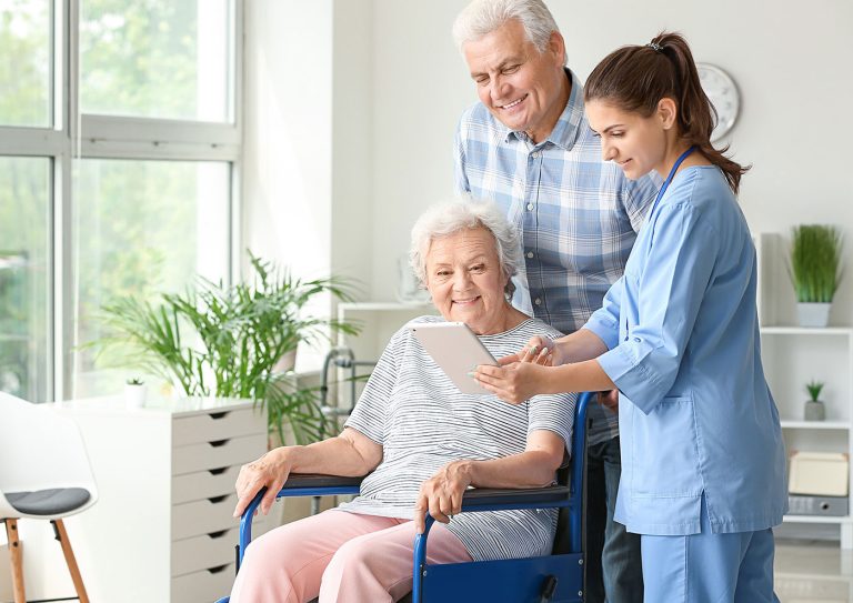 elderly couple with nurse