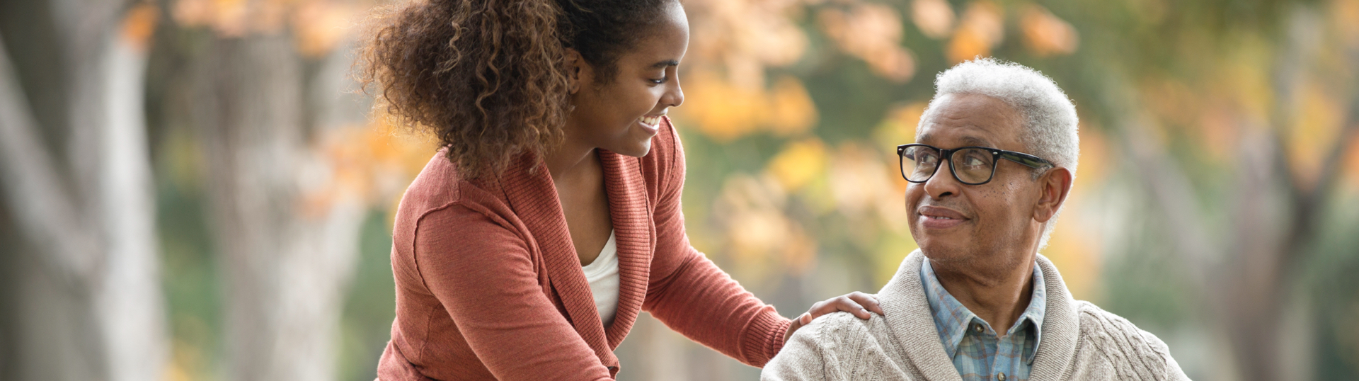 woman smiling down at elderly man