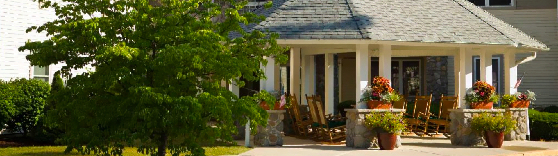 outside facility with many rocking chairs