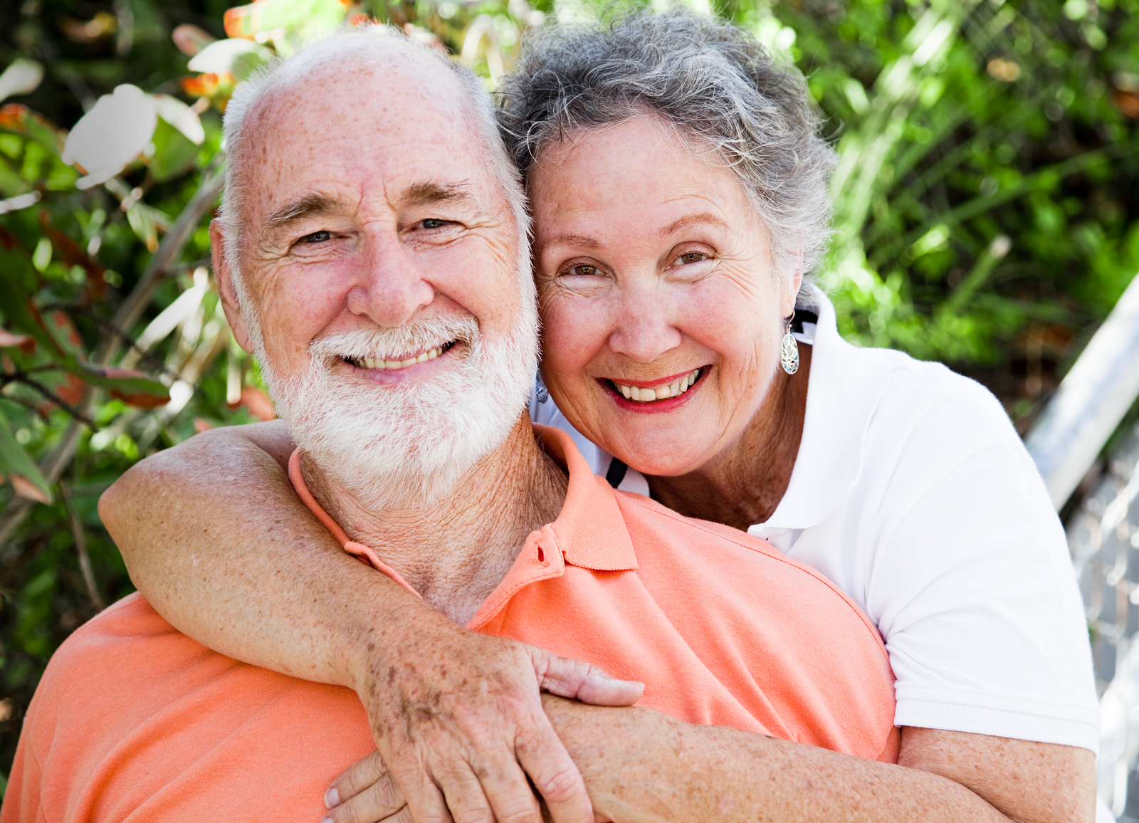 seniors hugging and smiling