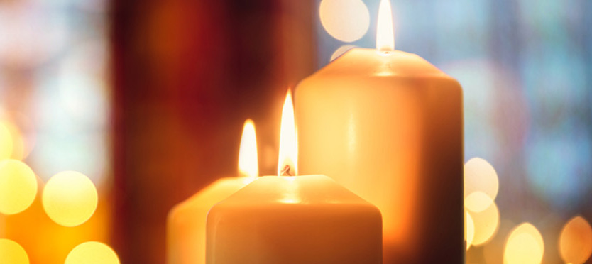 close up of three lit candles