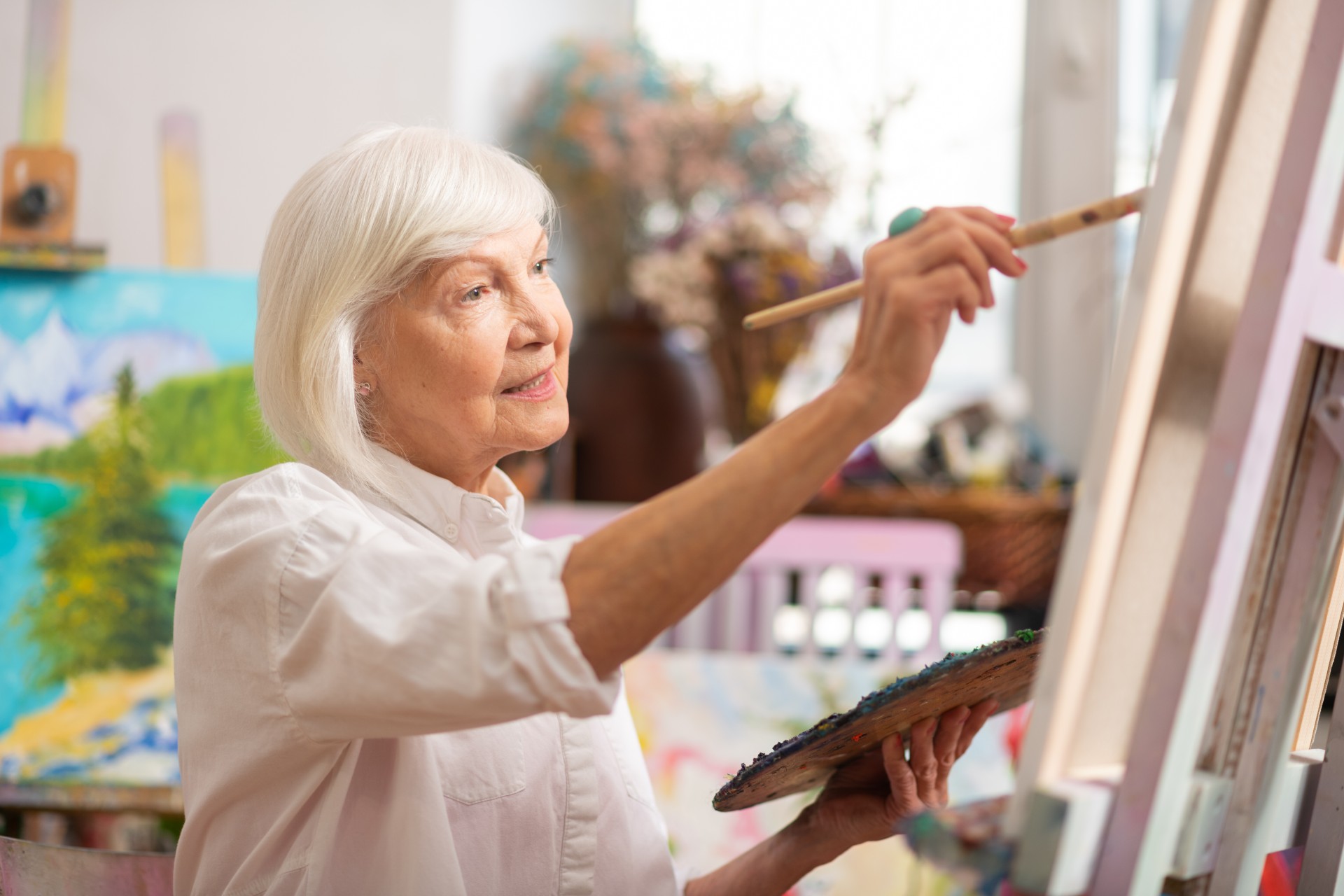 senior woman painting
