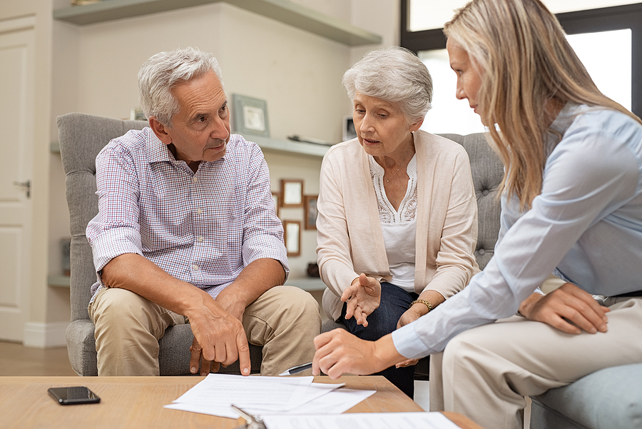 seniors discussing paperwork