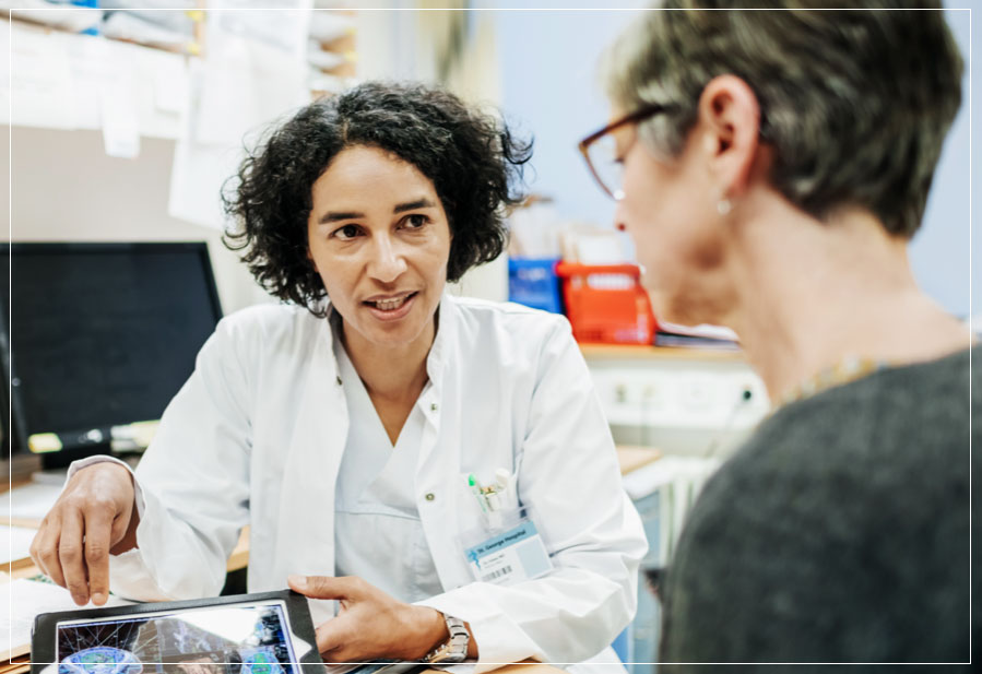 Female doctor talking with a patient