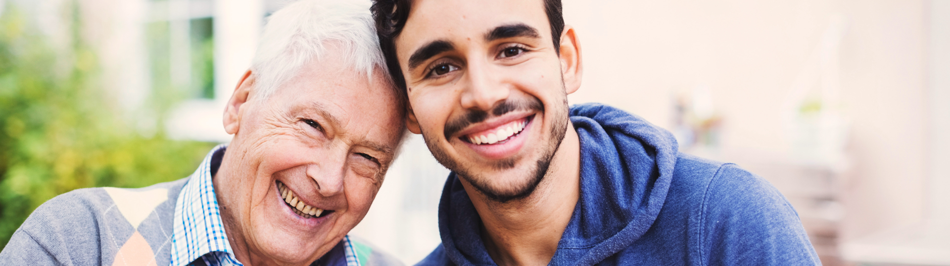 senior man smiling with younger man