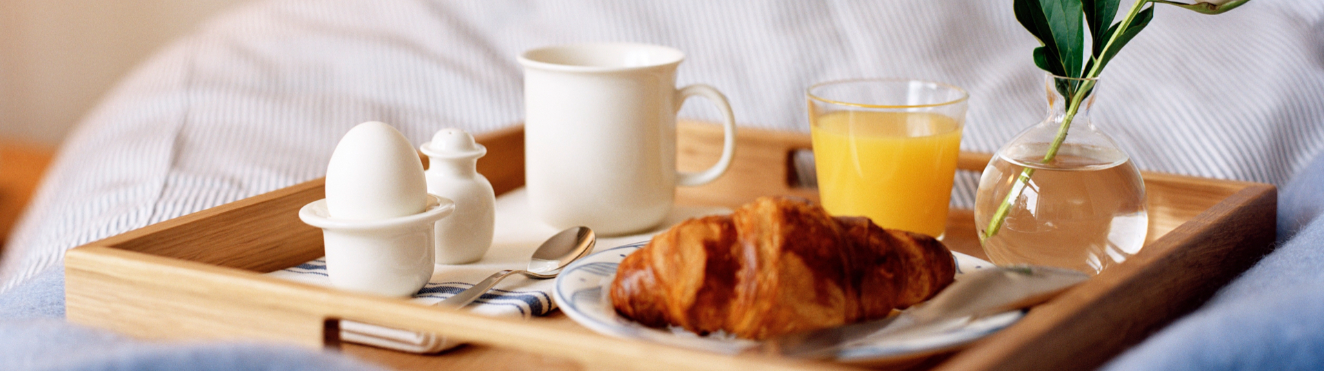 breakfast with coffee orange juice and a croissant