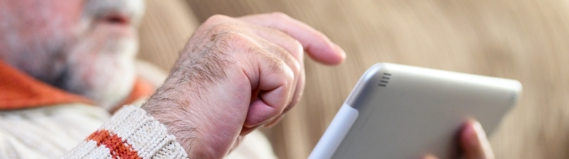 Close up on a senior man using a tablet 
